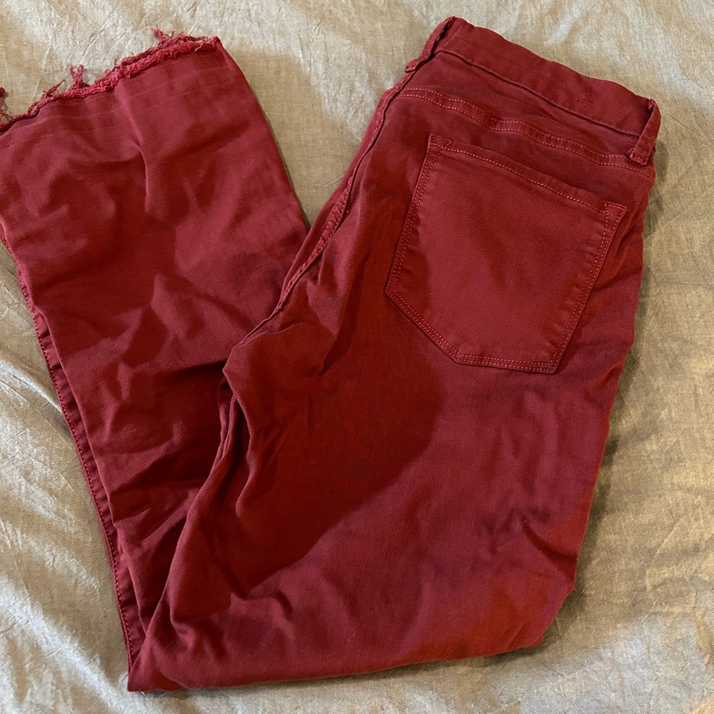 Red fashion jeans with frayed hem